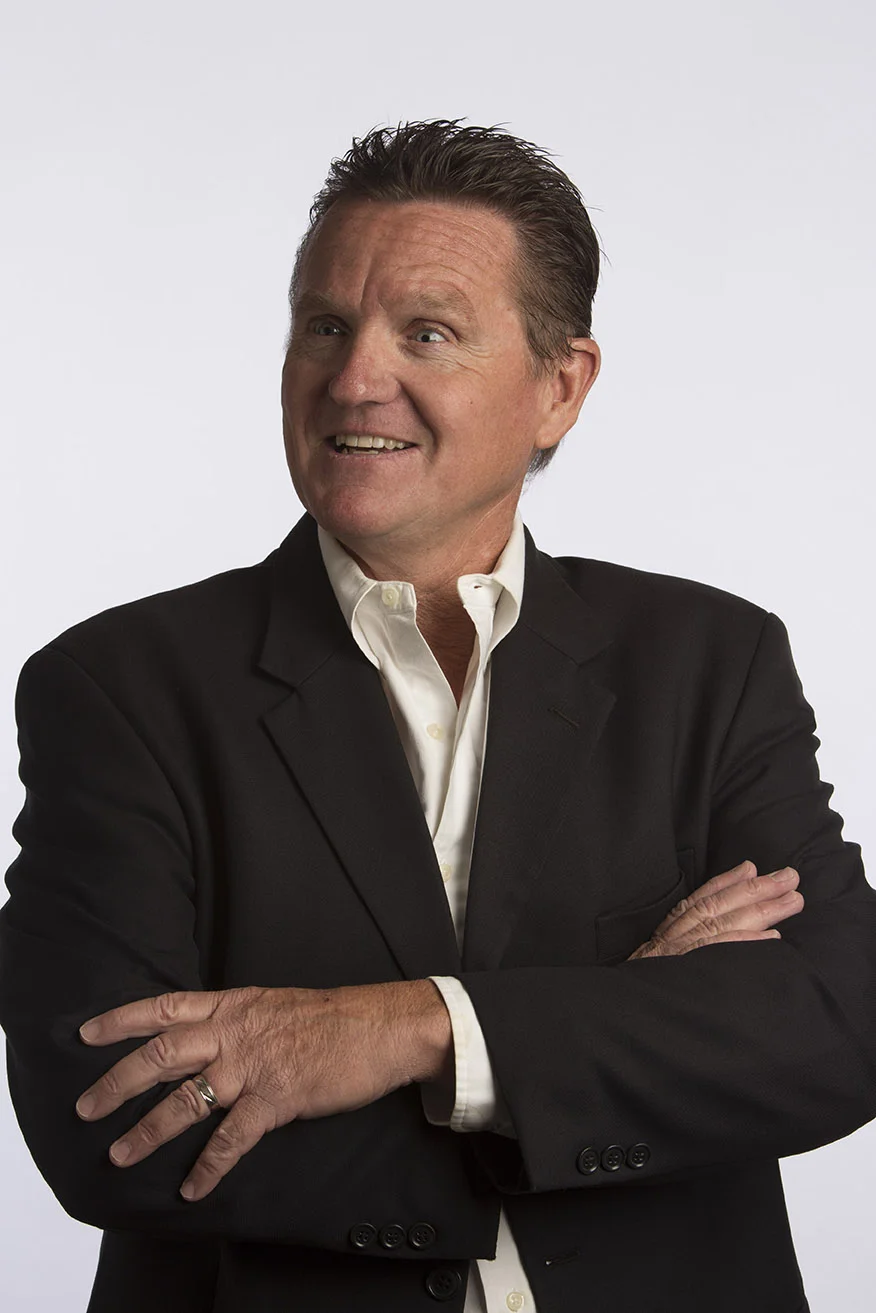 A headshot of Tom